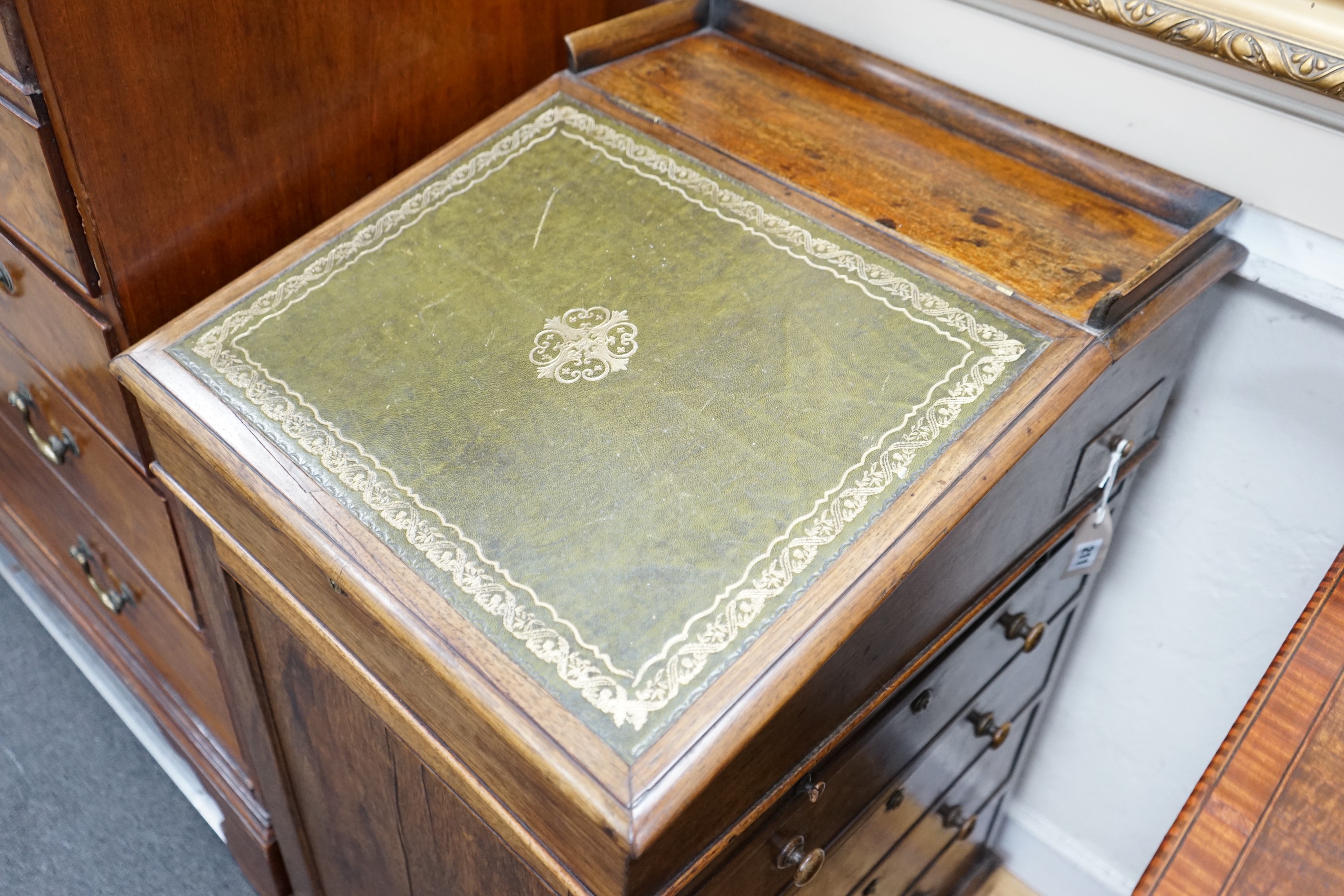 An early Victorian rosewood Davenport, with sliding top, width 50cm, depth 58cm, height 89cm